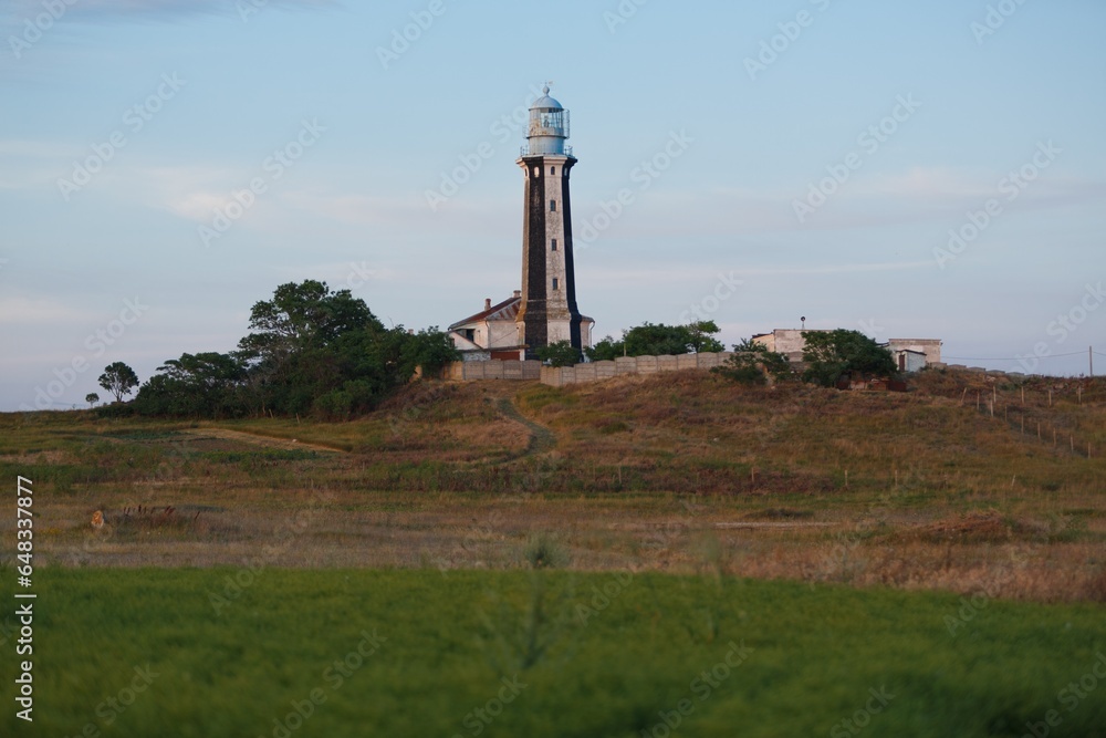 Lighthouse for ocean on island and field Lighthouse for ocean on island and field
