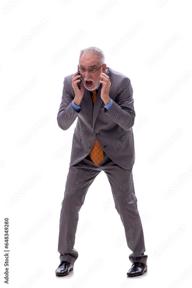 Old businessman talking by phone isolated on white Old businessman talking by phone isolated on white