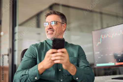 Obraz na plátně Crypto investor broker using smartphone trading app on cell phone