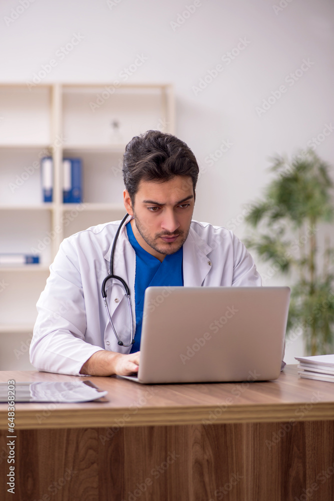 Young male doctor in telemedicine concept Young male doctor in telemedicine concept