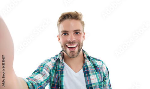 happy millennial selfie man in studio. photo of millennial selfie man wearing checkered shirt. © be free