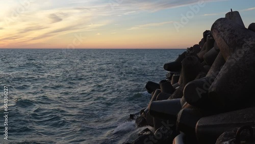 Waves crashing against the breakwater rocks at baltic sea - a liquid symphony