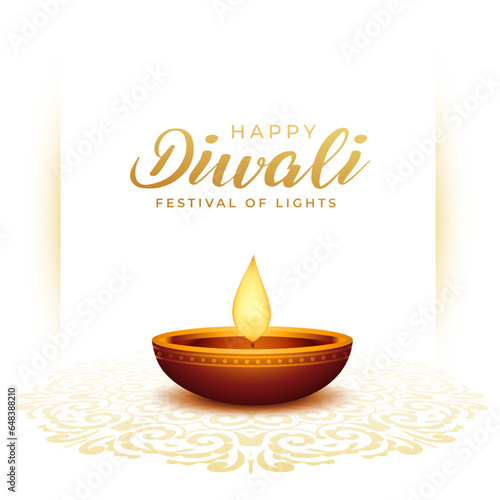 elegant happy diwali greeting card with glowing diya on rangoli design