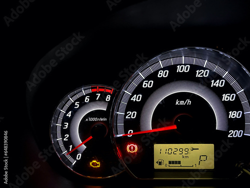 The car dashboard engine picture warning light illuminated that is having problems that show the fault indicators.