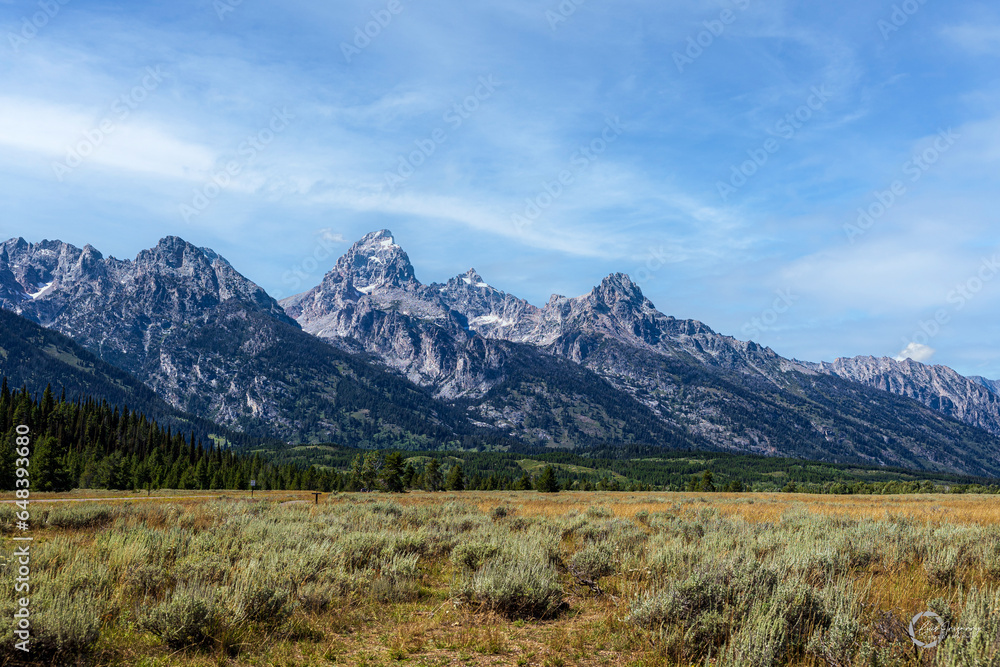 A stunning view of a beautiful mountain range, located at Grand Teton National Park in Northwest Wyoming.