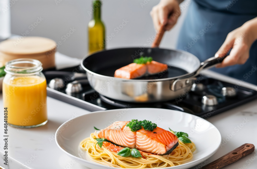 Salmon in a hot pan in the concept of healthy home cooking Salmon in a hot pan in the concept of healthy home cooking