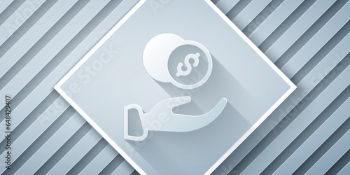 Paper cut Donation hand with money icon isolated on grey background. Hand give money as donation symbol. Donate money and charity concept. Paper art style. Vector
