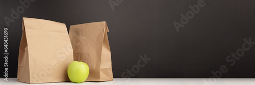 School lunch bag banner, responsible packaging, sustainable breakfast, eco-friendly paper bag