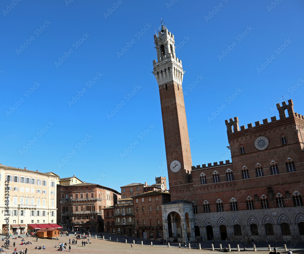 Siena, SI, Italy - February 20, 2023: tower called TORRE DEL MANGIA in the main square