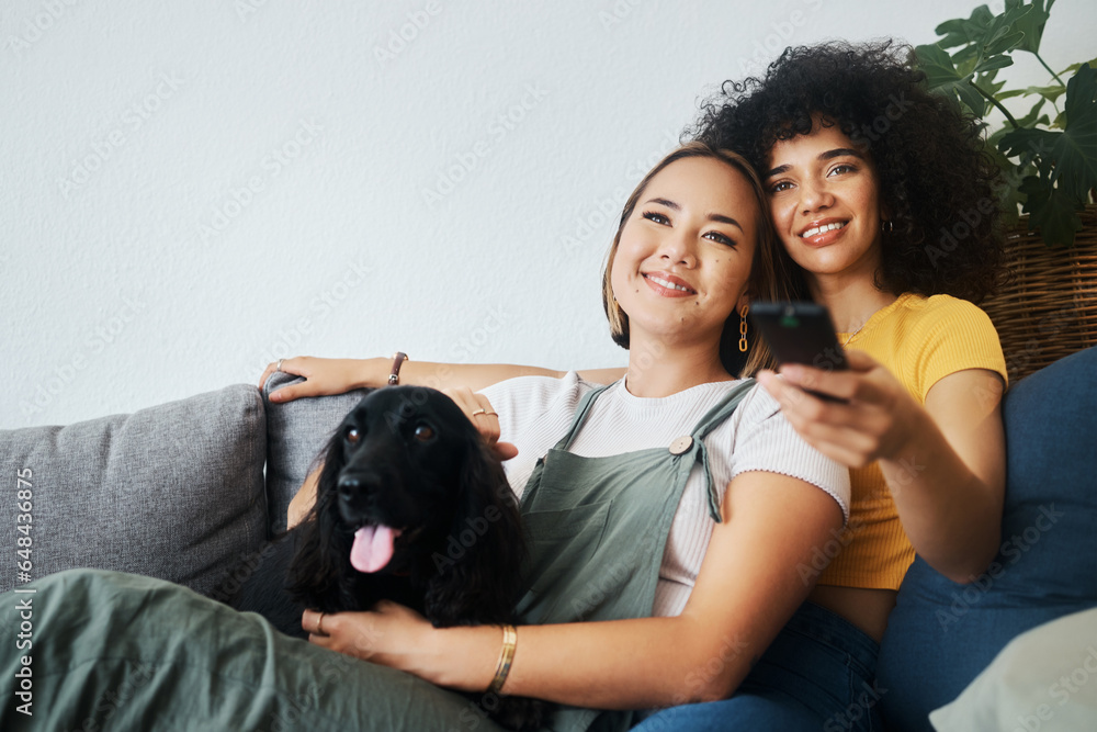 Dog, relax or gay couple watching tv in home together in a lgbtq love connection on living room sofa. Remote, sofa or happy lesbian women smile with pet, bond or care on couch for movie on television Dog, relax or gay couple watching tv in home together in a lgbtq love connection on living room sofa. Remote, sofa or happy lesbian women smile with pet, bond or care on couch for movie on television