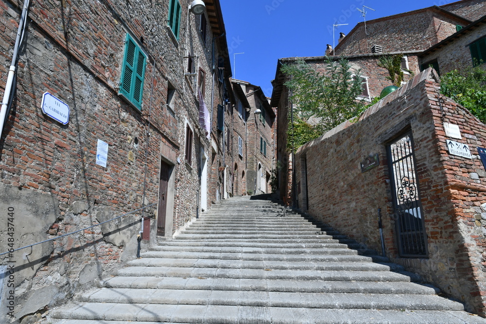 A street between the houses of Città della Pieve, a medieval village in Umbria, Italy.