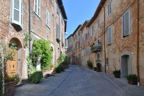 Fototapeta Naklejka Na Ścianę i Meble -  A street between the houses of Città della Pieve, a medieval village in Umbria, Italy.