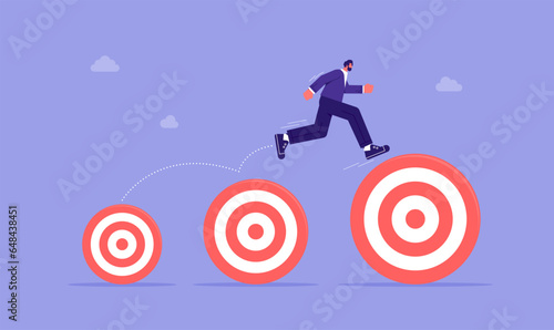 Businessman jumping up higher target career goals, aspiration and motivation to achieve bigger business target, advancement in career or business growth concept