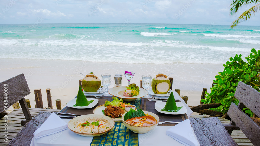 Romantic dinner on the beach in Koh Kood Thailand, dinner table with Asian food with fish and crab and lobster
