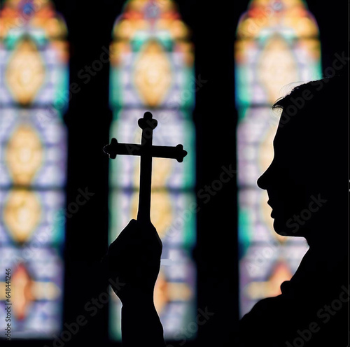 Silhouette of a man with Christian cross in front of stained glass window created using artificial intelligence