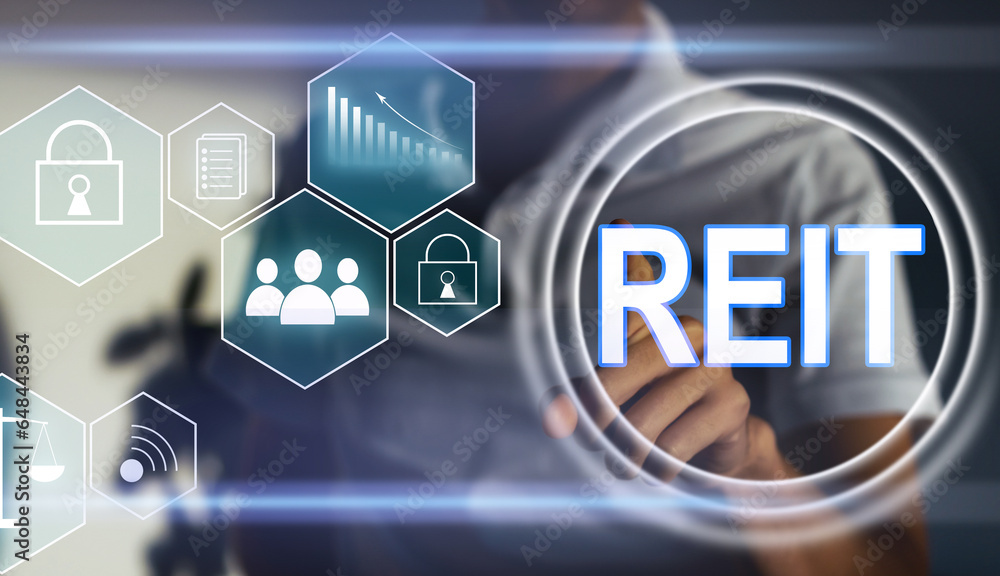 REIT, Real Estate Investment Trust concept, Person hand using smart phone with Real Estate Investment Trust icon on virtual screen. REIT, Real Estate Investment Trust concept, Person hand using smart phone with Real Estate Investment Trust icon on virtual screen.
