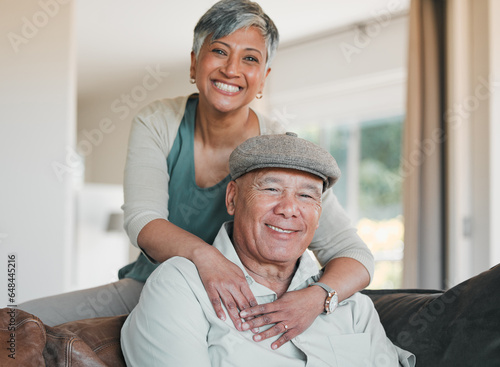 Senior couple, portrait and smile in home for retirement, marriage commitment and loyalty to partner. Happy man, woman and hug of support, trust and freedom to relax, love and together in living room