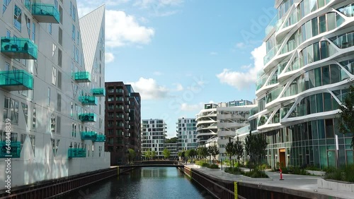 Aarhus, Denmark - 01 September, 2023: Modern residential buildings by the sea. Modern architecture. Iceberg - residential complex. City watetfront.