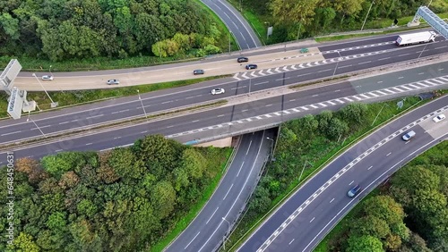 Junction 12 in Greater Manchester where outer ring road M60 intersects with M62 just at the outskirts of Manchester. Aerial Drone video.  photo