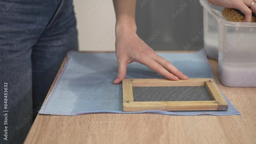 paper press. close-up. a woman collects moisture with a sponge. Close-up of a woman's hand. Slow motion video. High quality video recording in Full HD format. paper press. close-up. a woman collects moisture with a sponge. Close-up of a woman's hand. Slow motion video. High quality video recording in Full HD format.