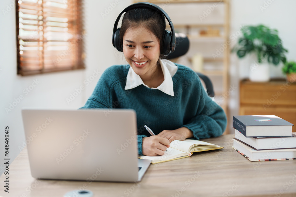 Studying online, beautiful Asian female student or student studying online at home Studying online, beautiful Asian female student or student studying online at home
