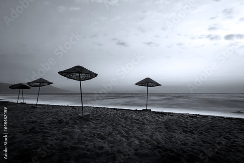 An empty beach landscape photographed with a long exposure technique. Black white photography.