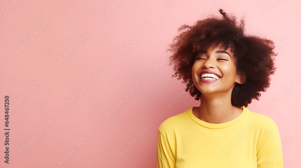African American woman laughing isolated on yellow background African American woman laughing isolated on yellow background
