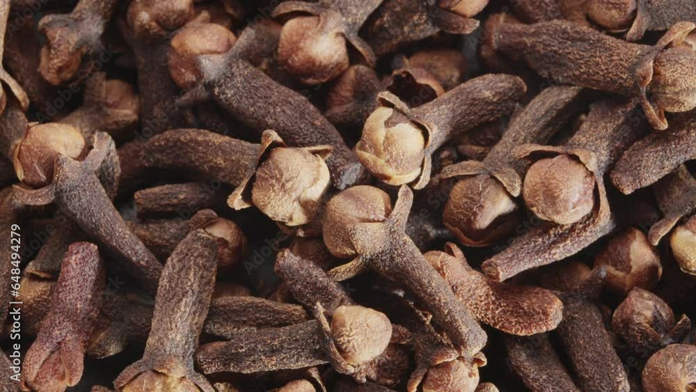 Lots of clove spices slowly scroll clockwise, macro video footage. A great background for your projects. Lots of clove spices slowly scroll clockwise, macro video footage. A great background for your projects.