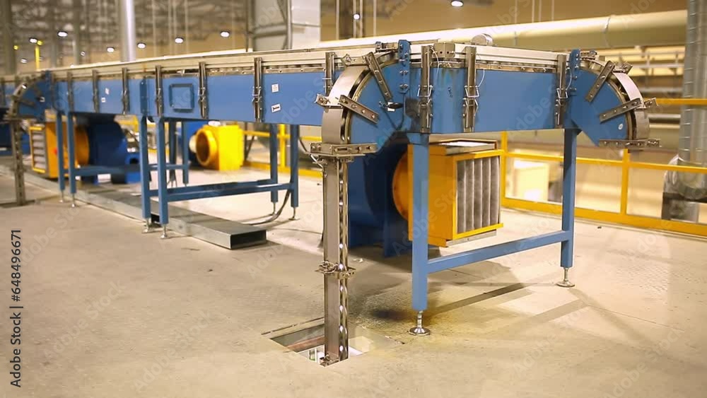 Factory for the production of beverages in aluminum cans. Conveyor line for finished products. Modern plant for the production of food packaging. Factory for the production of beverages in aluminum cans. Conveyor line for finished products. Modern plant for the production of food packaging.