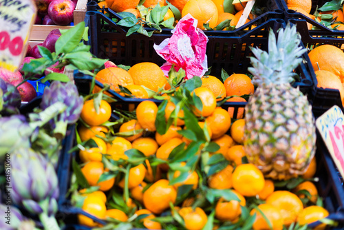 Open air market in Italy, different fruit. Madeira's fruits, pineapple lemon orange photo