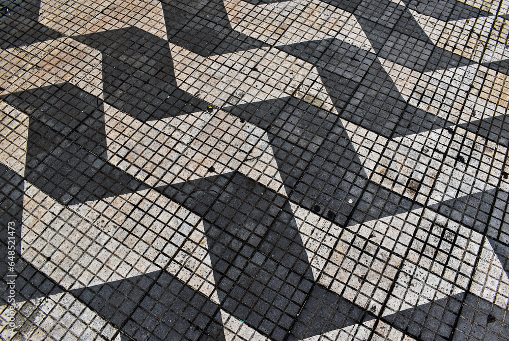 Pavement with black and white hydraulic tiles in Ribeirao Preto, Sao Paulo, Brazil