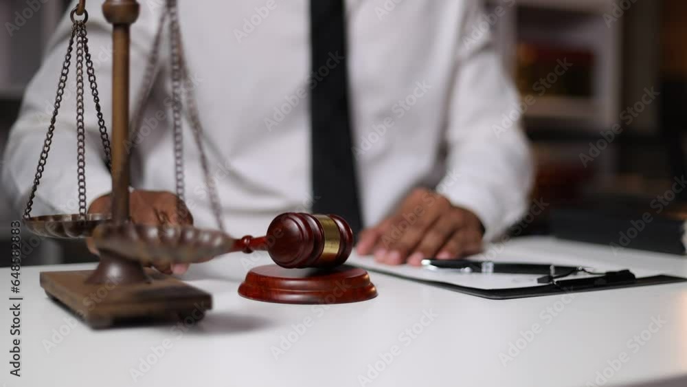 Judgment and legal justice concept, auction, The lawyer reads the document and signs the decision.