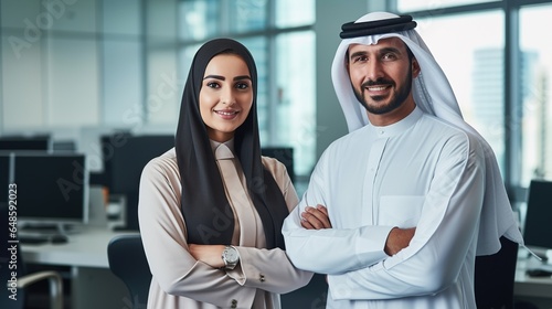 A guy and a lady dressed traditionally work in a Dubai business office. Portraits of prominent entrepreneurs, businessmen. Middle Eastern concept. generative ai photo