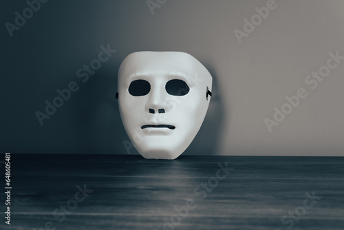 White anonymous mask on the table