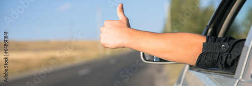 man thumb sitting in car