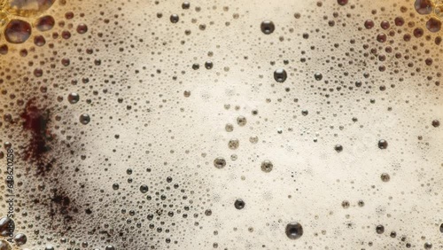 Beer foam texture. 4k video