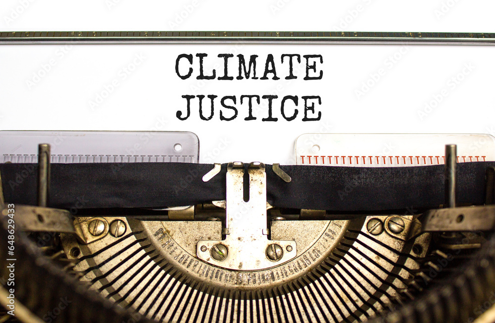 Climate justice symbol. Concept words Climate justice typed on beautiful old retro typewriter. Beautiful white paper background. Business environment climate justice concept. Copy space.