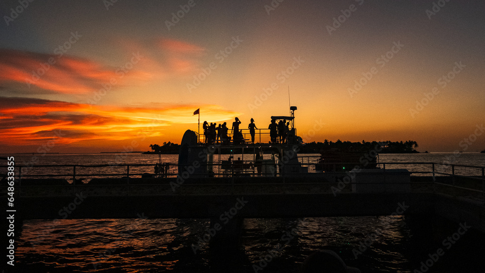 key west florida silhouette cruise party against the sunset 