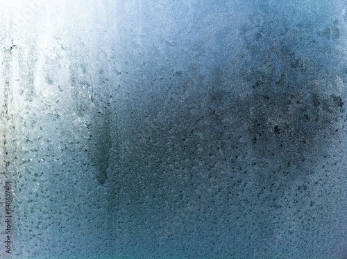 Frost on the window pane. Frosty pattern.
