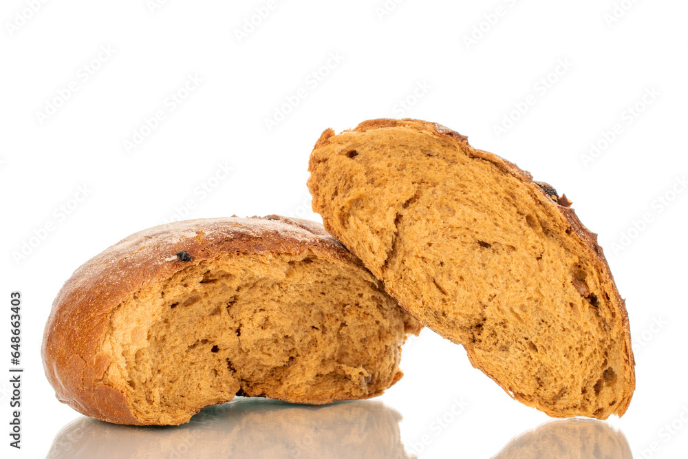 Loaf of bread broken in half with raisins, macro, isolated on white background. Loaf of bread broken in half with raisins, macro, isolated on white background.