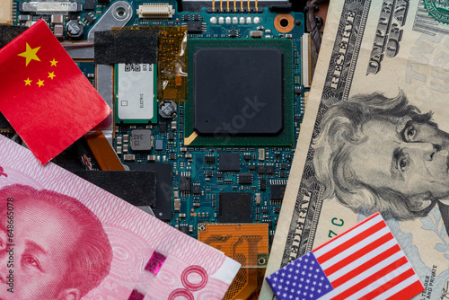 Photography A technology conflict, competition concept with the American and Chinese flags on top of a semiconductor circuit board