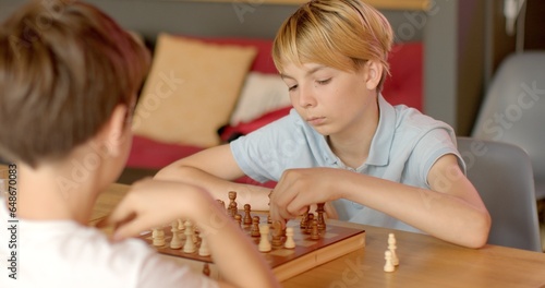 Quadro su tela Children Engaging in Chess at School Competitions
