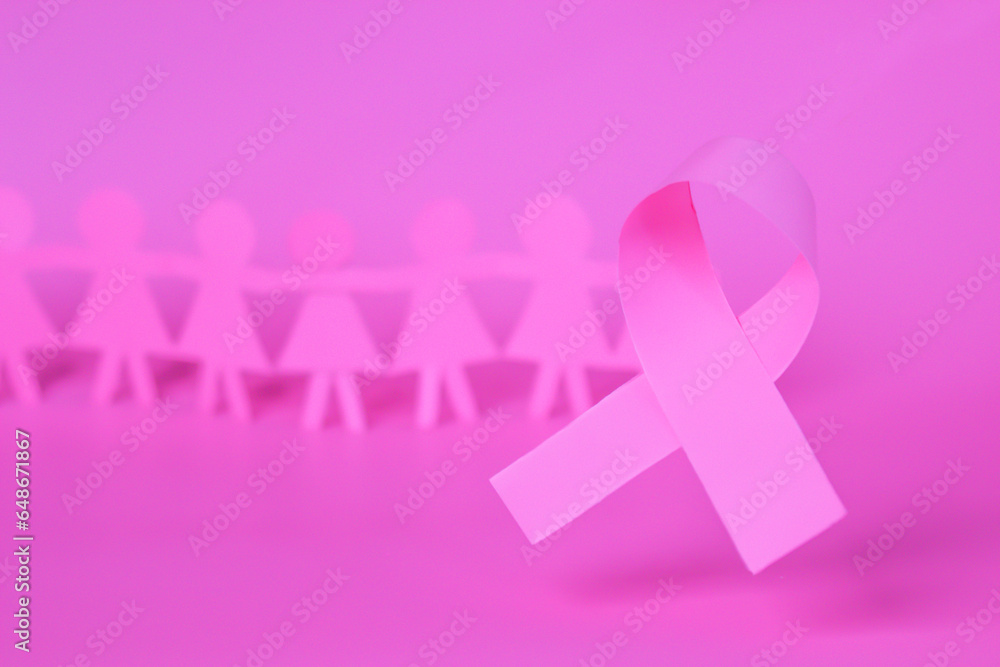 Pink Breast Cancer Awareness Ribbon. Pink paper ribbon bow with blur background of paper woman. October Pink day, world cancer day. Pink Breast Cancer Awareness Ribbon. Pink paper ribbon bow with blur background of paper woman. October Pink day, world cancer day.