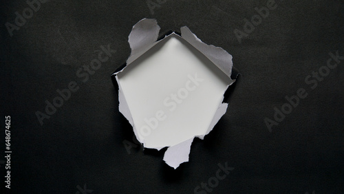Torn paper. Vector illustration of torn black paper sheet isolated on transparent background