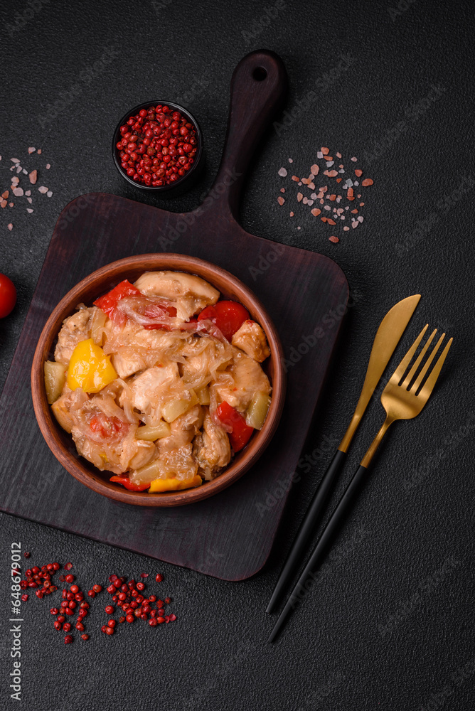 A delicious dish consisting of slices of chicken, sweet peppers and onions A delicious dish consisting of slices of chicken, sweet peppers and onions