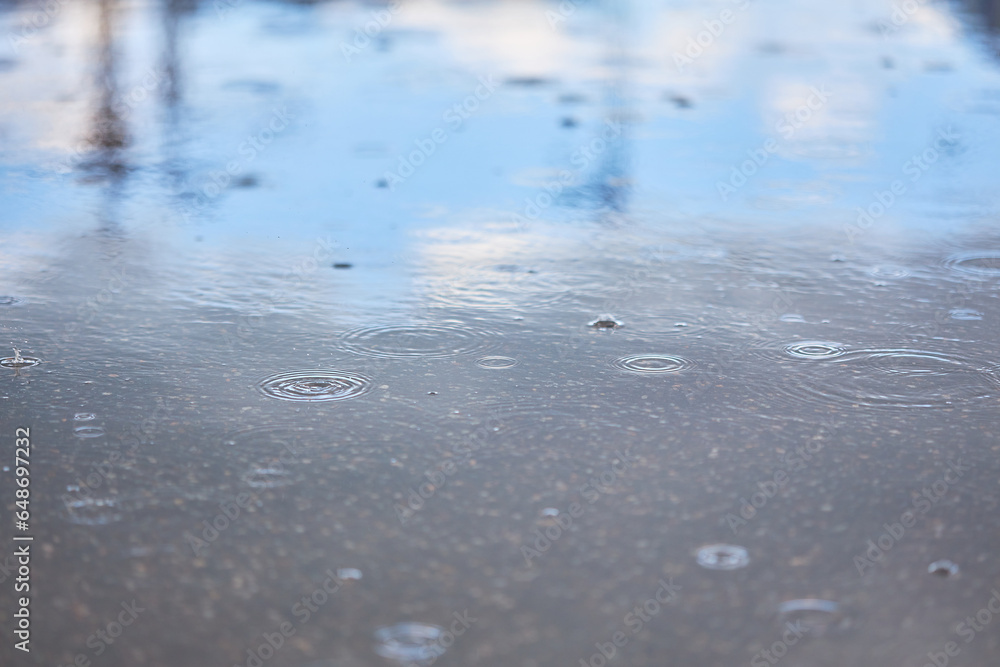 Heavy rain falling on the asphalt, puddles with splashes from drops.. Heavy rain falling on the asphalt, puddles with splashes from drops..