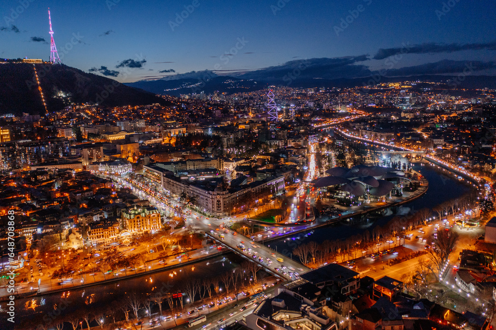 Panoramic night aerial view of Tbilisi, capital of Georgia from drone - obrazy, fototapety, plakaty 