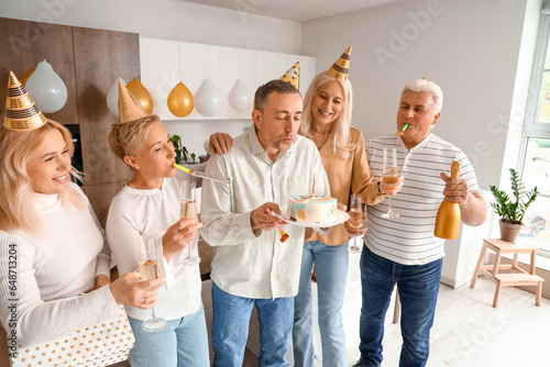 Adult friends celebrating a...