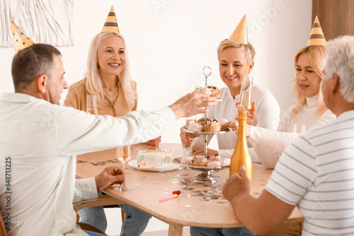 Happy senior friends celebr...