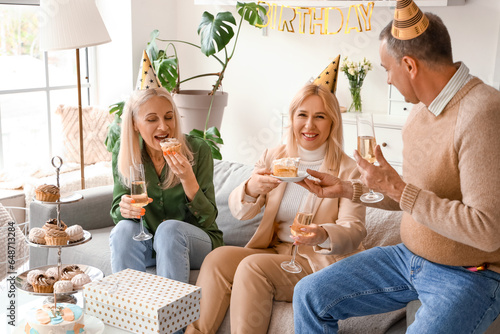 Mature people celebrating B...